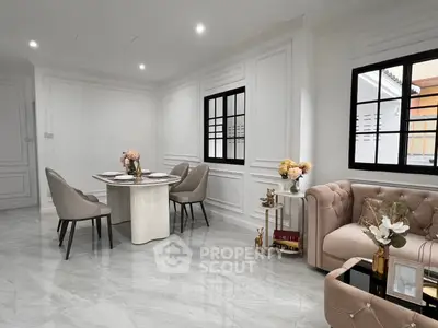 Elegant living room with modern decor, featuring plush seating and a stylish dining area, perfect for luxury living.