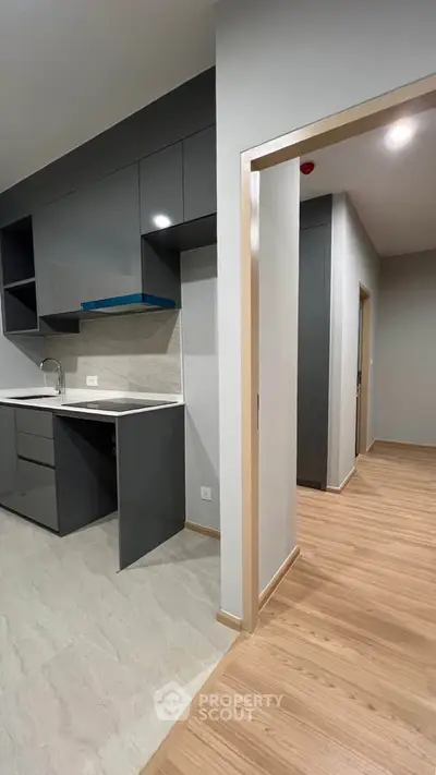 Modern kitchen with sleek cabinetry and open layout in a stylish apartment
