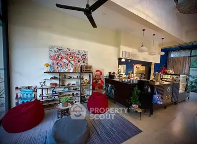 Stylish modern living room with open kitchen and vibrant decor