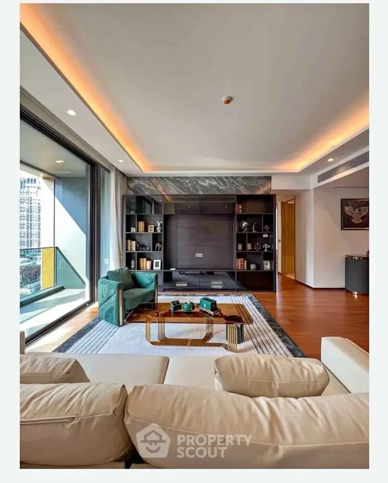 Luxurious modern living room with elegant decor and large windows offering city views.