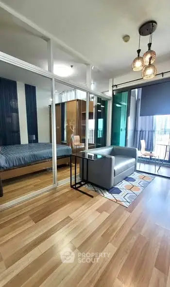 Modern living room with glass partition and stylish decor in urban apartment