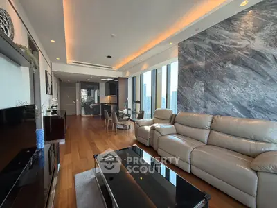 Luxurious modern living room with leather sofas and city view