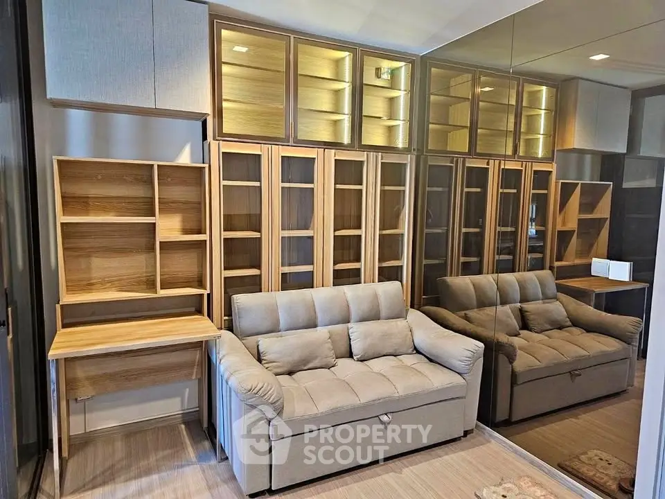 Modern living room with stylish shelving and comfortable sofa, perfect for urban living.