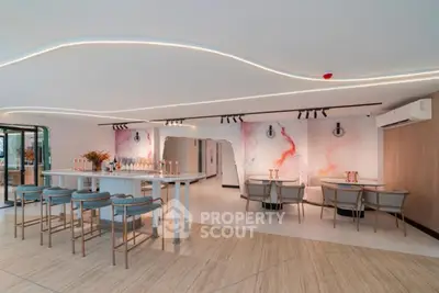 Modern open-concept living space with stylish decor and ambient lighting
