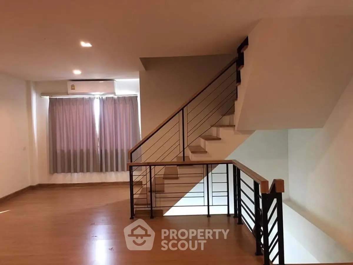 Modern duplex interior with wooden flooring and stylish staircase