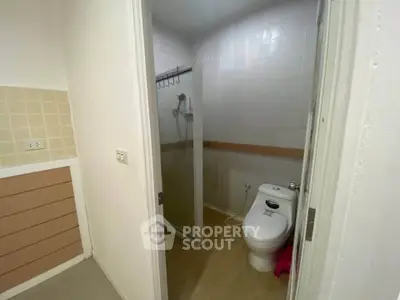 Compact bathroom with shower and toilet in modern apartment