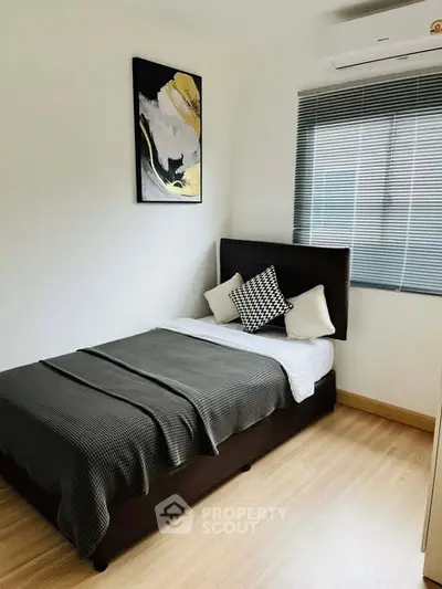 Cozy modern bedroom with stylish decor and natural light