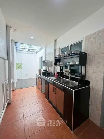 Modern kitchen with sleek cabinetry and ample natural light, perfect for culinary enthusiasts.