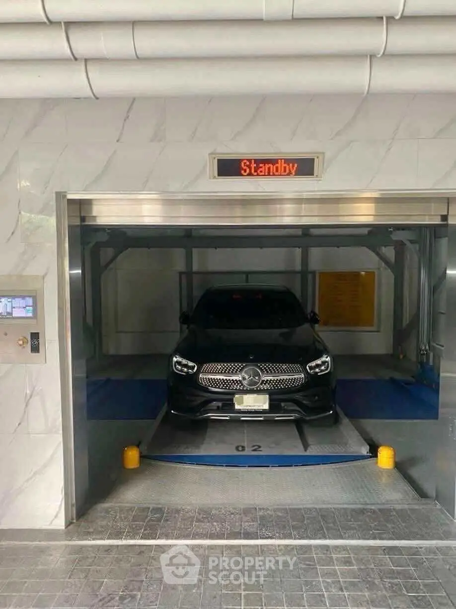 Modern automated parking system with luxury car in sleek urban garage.