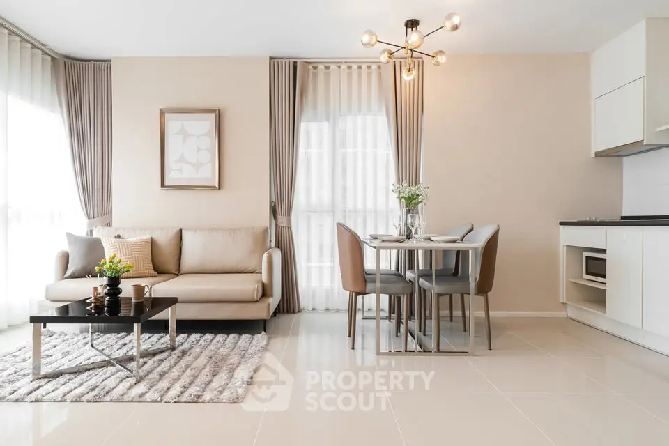 Modern living room with elegant decor and dining area in open layout apartment.