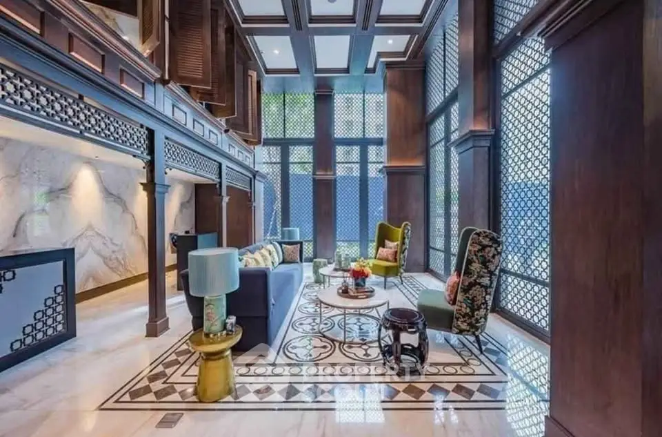 Luxurious living room with high ceilings and elegant decor