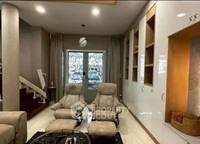 Luxurious living room with plush seating and elegant decor in a modern home.