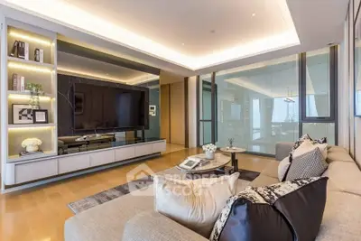 Luxurious modern living room with sleek design and large TV, perfect for relaxation.