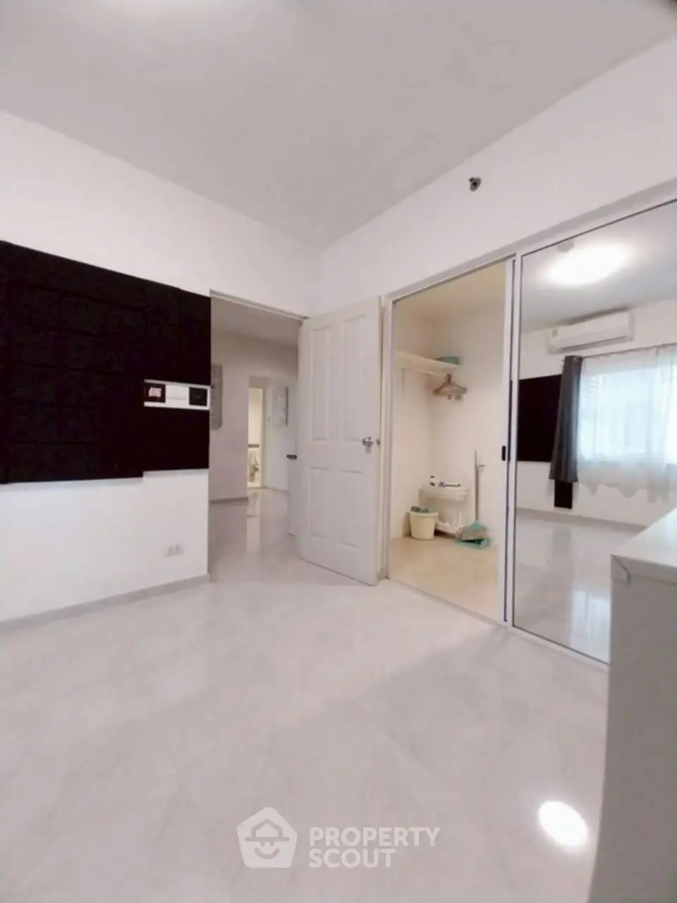 Spacious bedroom with mirrored closet and modern design