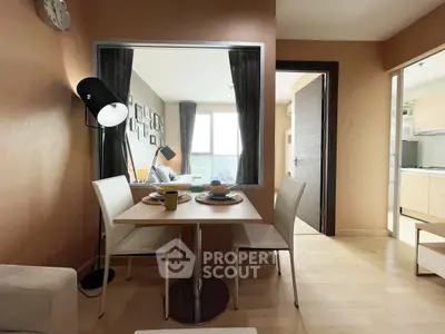 Modern open-plan living and dining area with stylish decor and natural light.