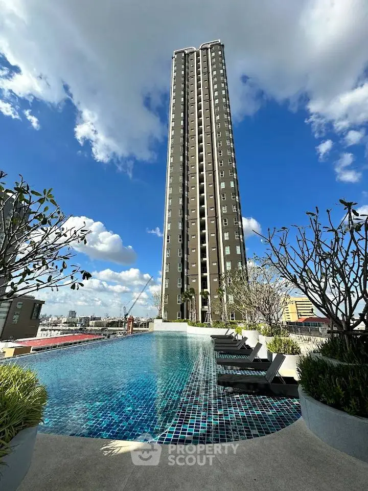 Stunning high-rise building with luxurious rooftop pool and city views.