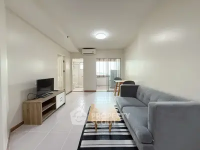 Spacious modern living room with sleek furniture and natural light