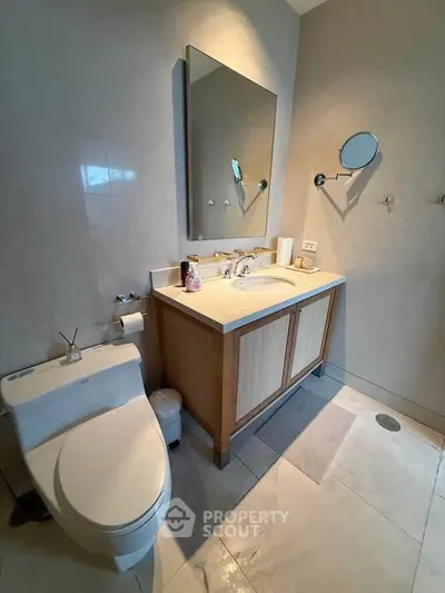 Modern bathroom with sleek fixtures and elegant vanity in a stylish home.