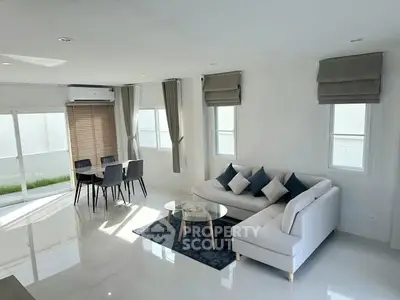 Modern living room with sleek furniture and natural light