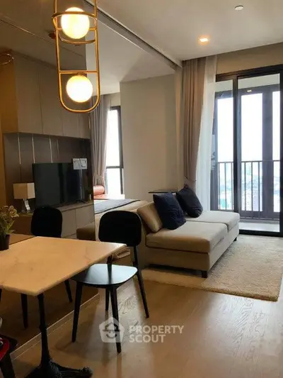 Modern open-plan living room with stylish decor and balcony view