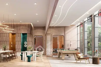 Luxurious modern interior with pool table and stylish seating in a bright, open space.