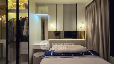 Cozy modern bedroom with stylish lighting and built-in closet