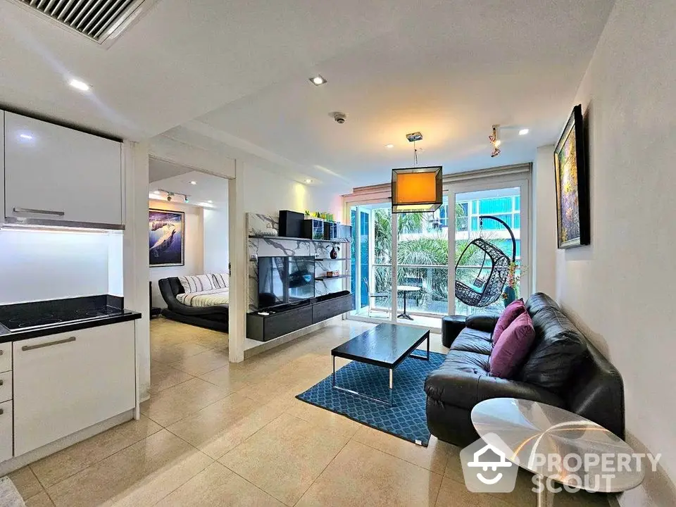 Modern living room with sleek furniture and balcony view in luxury apartment