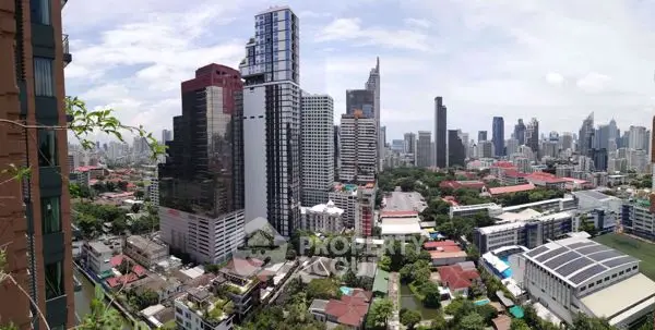 Stunning cityscape view showcasing modern skyscrapers and lush greenery in a vibrant urban setting.