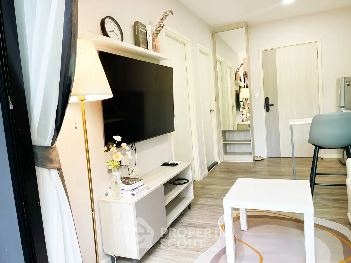 Modern living room with stylish decor and wall-mounted TV