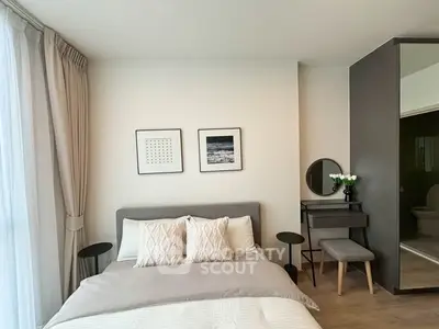 Modern bedroom with stylish decor and natural light