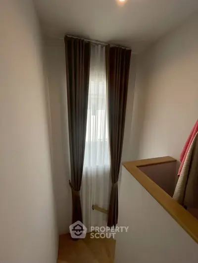 Cozy stairway with elegant curtains and natural light