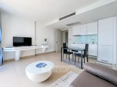 Modern living room with sleek kitchen and stylish furniture in open layout