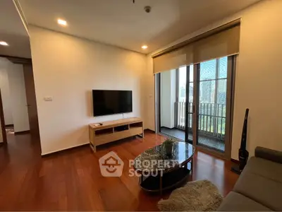 Modern living room with wooden floors and balcony view