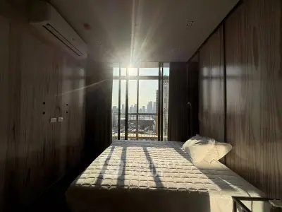 Modern bedroom with stunning city view and natural light
