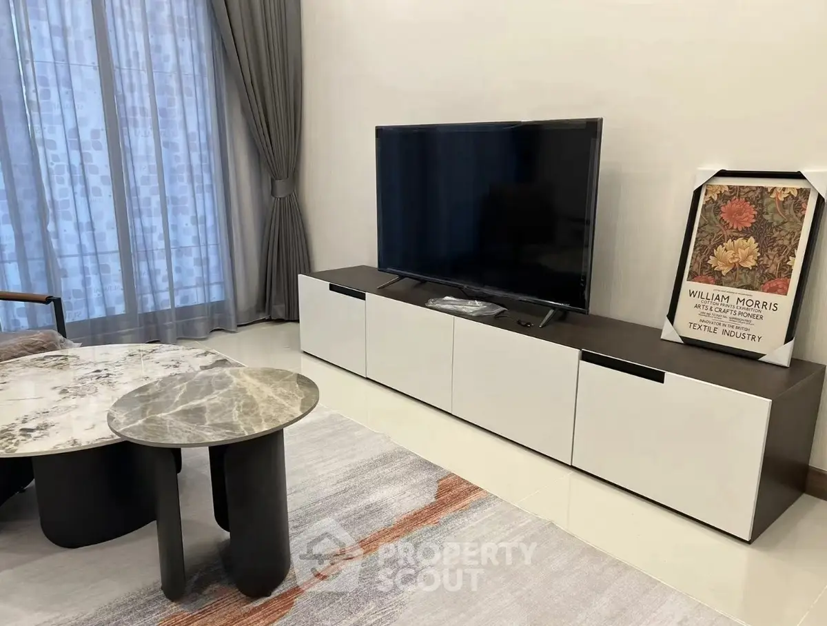 Modern living room with sleek TV stand and stylish coffee tables
