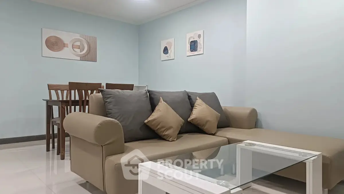 Modern living room with stylish furniture and elegant decor in a cozy apartment setting.