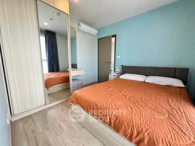 Modern bedroom with mirrored wardrobe and stylish decor