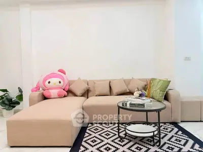 Stylish living room with modern beige sectional sofa and chic decor