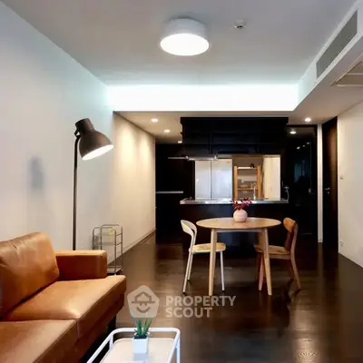 Modern living room with open kitchen and stylish furniture