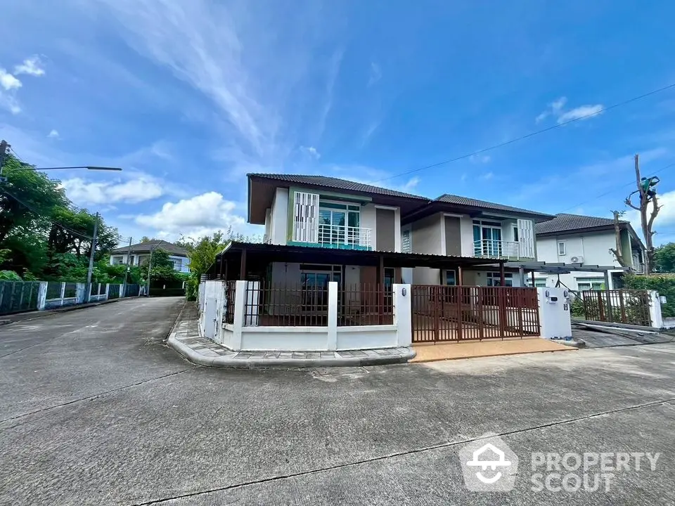 Spacious corner unit house with modern design and large driveway in a serene neighborhood.