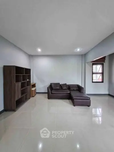 Spacious living room with modern sofa and sleek shelving unit