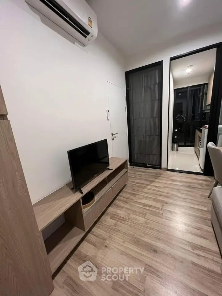 Modern living room with sleek design and wooden flooring