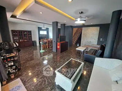 Spacious modern living room with marble flooring and stylish furniture