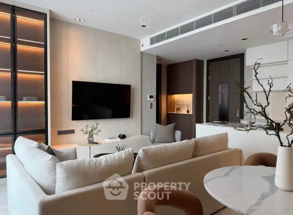 Luxurious modern living room with open kitchen and elegant decor