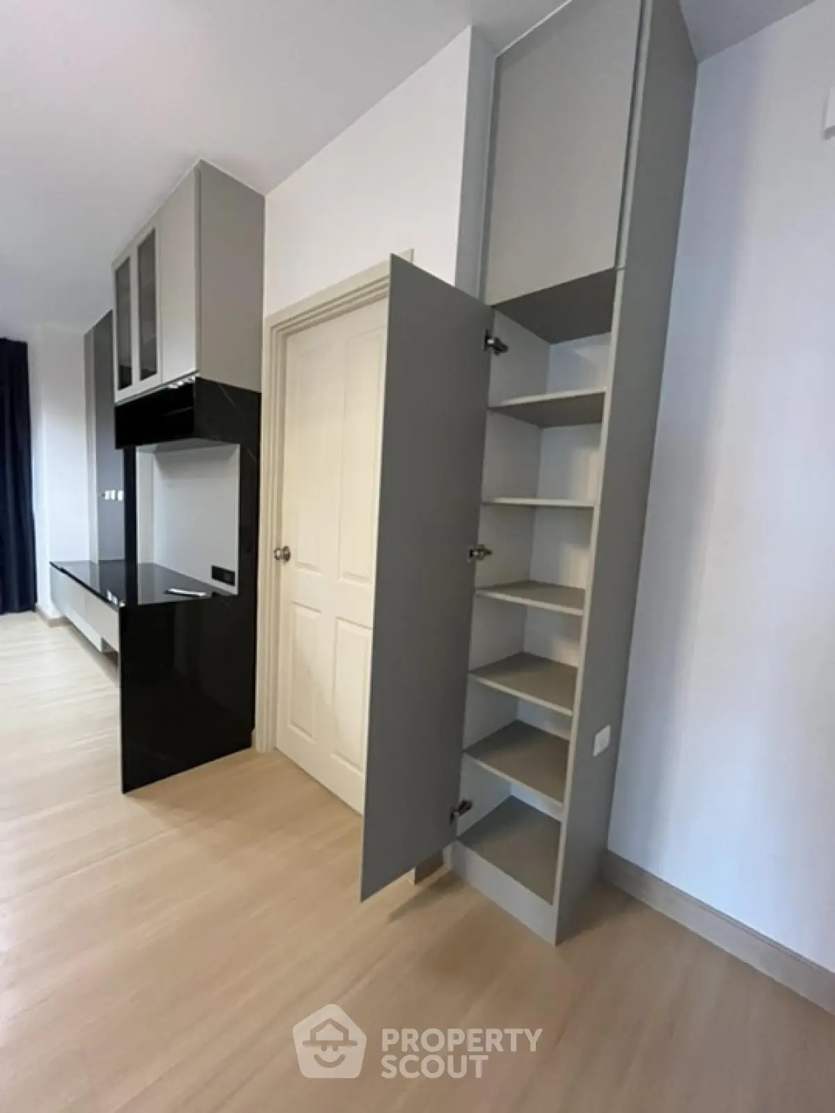 Modern apartment interior with sleek storage solutions and minimalist design