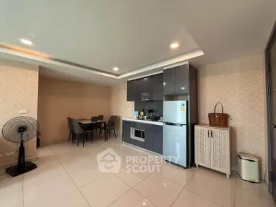 Modern open-layout kitchen with dining area and sleek cabinetry