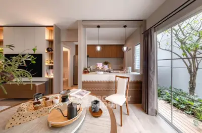 Modern open-layout kitchen with stylish decor and garden view
