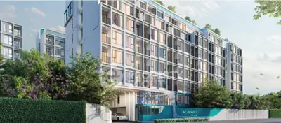 Modern residential building with stylish facade, lush greenery, and secure entrance, ideal for urban living in a serene environment.