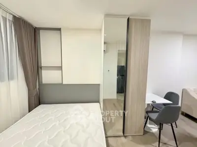 Modern bedroom with stylish furniture and cozy ambiance in a contemporary apartment.