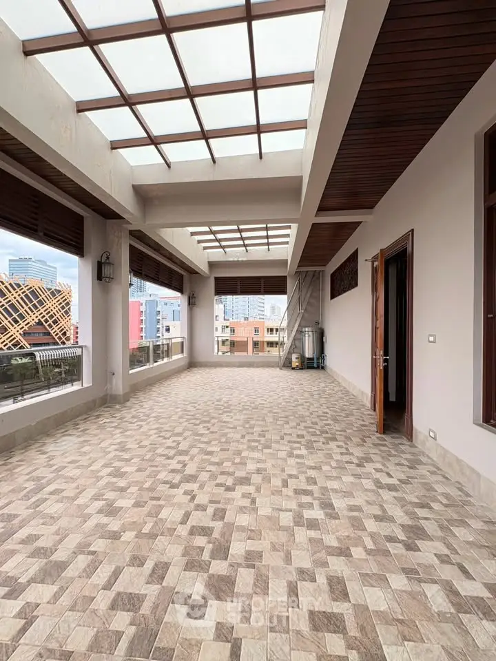 Spacious rooftop terrace with city views and modern design, perfect for outdoor gatherings.